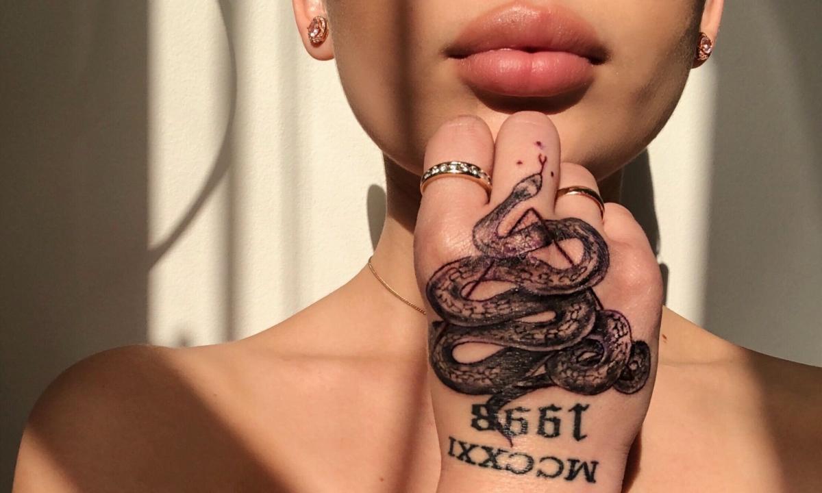 What is meant by cobra tattoo on hand