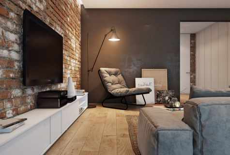 Creation of stylish interior: wall-paper under brick