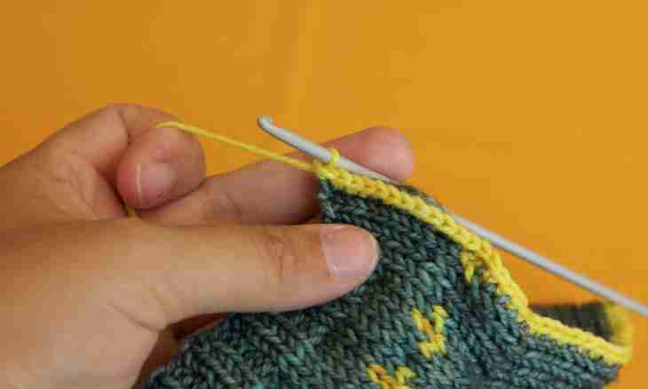 How to knit by a hook a hat for the girl