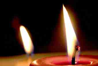 Why the flame of a candle is established vertically