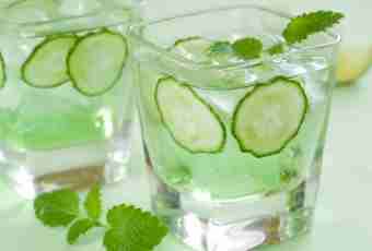 Fresh-salted cucumbers on sparkling water