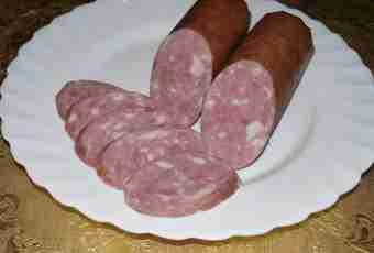 Home-made boiled sausage the hands