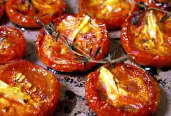 The stuffed tomatoes in an oven