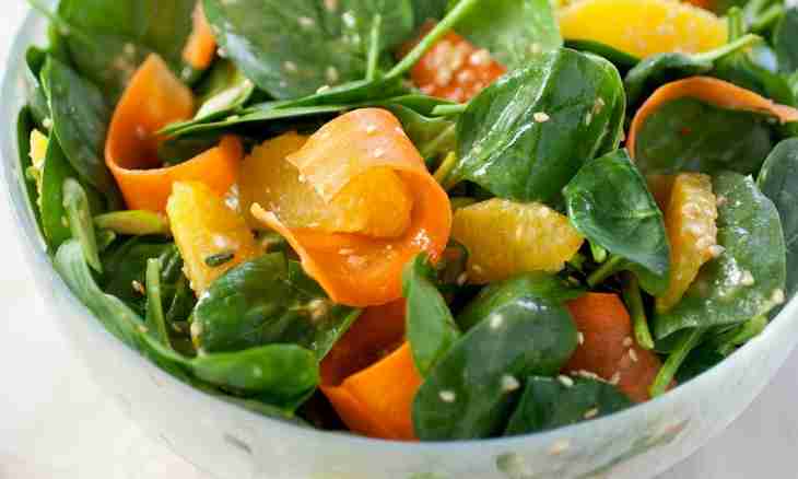 Light salad from fresh cabbage with carrots and oranges