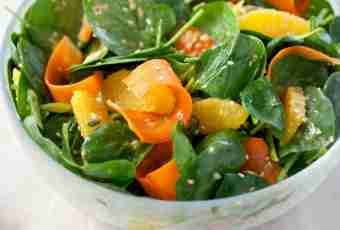 Light salad from fresh cabbage with carrots and oranges